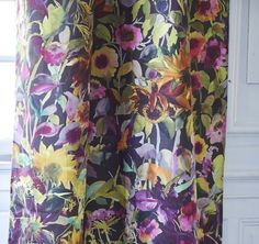 the curtains are covered with colorful flowers