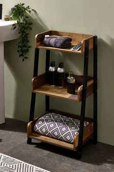 a bathroom with a wooden shelf next to a sink