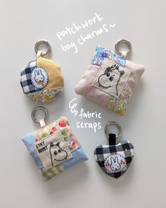 four keychains with different designs on them and the words patchwork baby charms