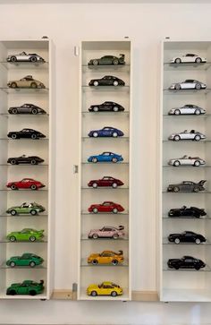 several shelves filled with different types of toy cars