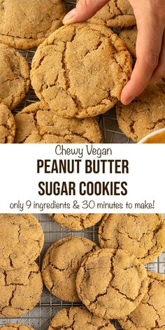 the peanut butter sugar cookies are cooling on a wire rack and being held up by someone's hand