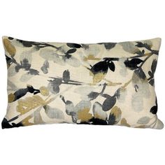 a rectangular pillow with black and gold leaves on it, sitting on a white background