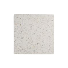 a white tile with small rocks on it