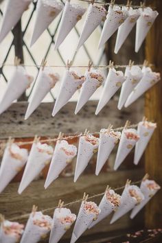 some paper umbrellas are hanging on a clothes line and there is also an instagram post about them