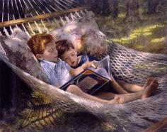 two boys are reading in a hammock