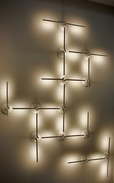 a white wall with several lights on it