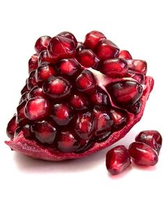 the pomegranate is cut in half and ready to be eaten