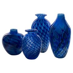 three blue vases sitting next to each other