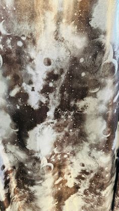 an image of the back of a man's shirt that is covered in water