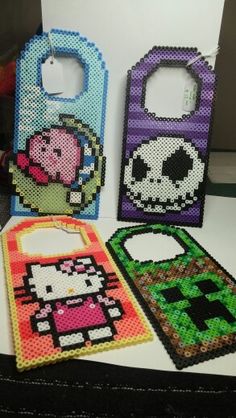 four bags made out of perler beads are on the table next to each other