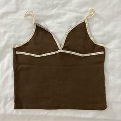 Brand New With Tags. One Size. Fits Xsmall-Small. Brown Color With Cream Lace Straps Perfect For Cowgirl Theme. Perfect Color For Fall Brown Cotton Tank Top For Day Out, Chic Brown Cotton Tank Top, Khaki Crop Top For Summer, Summer Cotton Brown Tank Top, Summer Brown Cami Top, Brown Cami Top For Spring, Vintage Cotton Cami Top, Brown V-neck Summer Top, Summer Brown V-neck Top