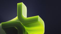 an abstract green sculpture against a dark background