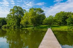 a wooden dock sitting next to a body of water