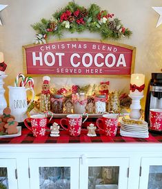 a christmas themed buffet with hot cocoa and candy