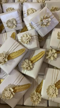 many white boxes with gold flowers on them