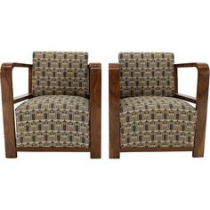 a pair of wooden chairs with patterned upholstered fabric on them, side by side