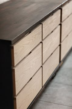 a large wooden dresser sitting on top of a tiled floor