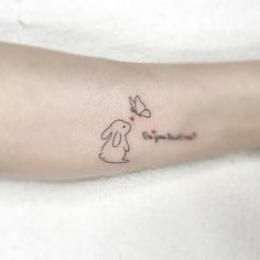 a person with a small tattoo on their arm