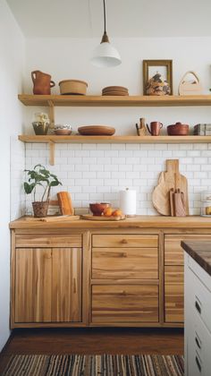 the kitchen is clean and ready for us to use it's natural wood accents