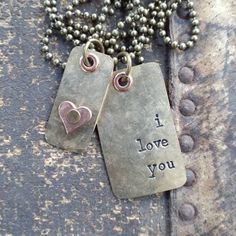 two dog tags with i love you written on them