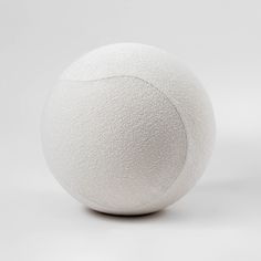 a white ball sitting on top of a table