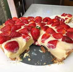 there is a cake with strawberries on it