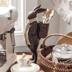 a kitchen counter topped with lots of different types of utensils and other items