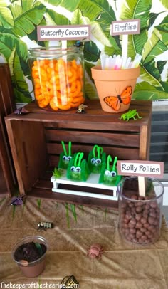 a table topped with lots of carrots and other items on top of a wooden shelf