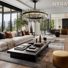 a living room filled with lots of furniture and a chandelier hanging from the ceiling