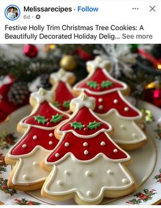 three decorated christmas tree cookies on a plate