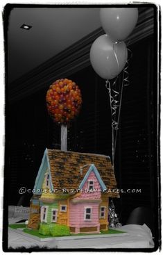 a house with balloons on top of it