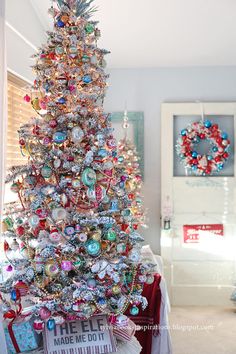 a decorated christmas tree in a living room