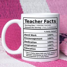 a white coffee mug sitting on top of a pink and white blanket with information for teachers