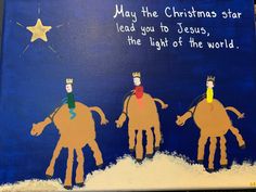 three children's handprints on a blue background with the words may the christmas star lead you to jesus, the light of the world