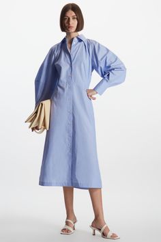 Crafted from cotton, this midi shirt dress is cut for a regular fit and features a modern update with a structured raglan sleeve, wide collar and waisted silhouette. The side seam pockets add a practical finishing touch.- Structured dart at the back- Long cuffed sleeves100% Cotton / Machine wash warmBack length of size 6 47½" Cos Shirt, Raglan Sleeve Shirt, Knitted Dresses, Led Fashion, Blue Shirt Dress, Printed Dresses, Summer Blue, Midi Shirt Dress, Cotton Poplin