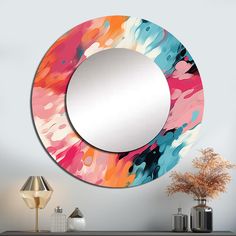 a mirror that is sitting on top of a dresser next to a lamp and vase