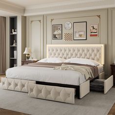 a bedroom with a bed, dressers and pictures on the wall above it's headboard