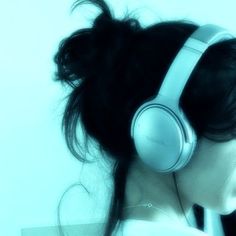 a woman with headphones on her ears