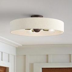 a white ceiling light hanging from the ceiling