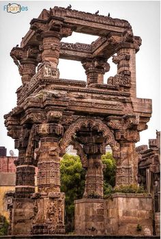 an old stone structure with carvings on it