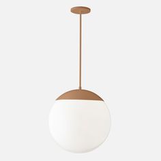 a white and brown light hanging from a ceiling fixture with an oval shape on it