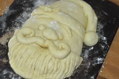 the dough has been made to look like an old man's face and beard