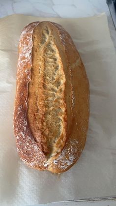 a loaf of bread sitting on top of a piece of paper