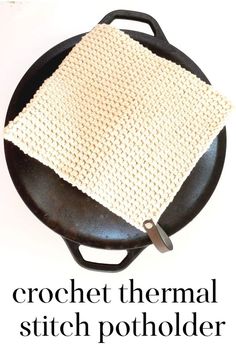 crochet thermie stitch on top of a black skillet with a white cloth