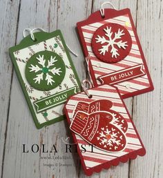 three christmas tags with snowflakes on them