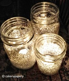 there are three jars with gold glitter on them