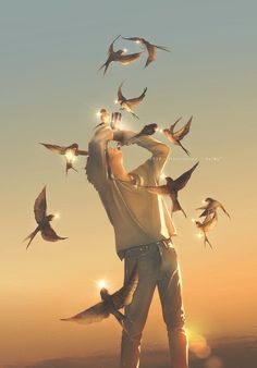 a man is surrounded by birds in the air with his hands on his hips as he looks up into the sky