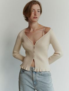 This Heart Neck Cardigan showcases a charming and feminine design that's perfect for layering. The heart-shaped neckline adds a unique and romantic touch, while the ribbed texture provides both comfort and fit. It's a versatile piece that can elevate a casual outfit or add a cozy element to a more dressed-up look. - Features a delicate button-down front which allows for easy wearing and adds subtle detail.- Constructed with a soft, stretchable fabric that hugs the body for a flattering fit.- The long sleeves and ribbed cuffs offer additional warmth and style.- This cardigan's cropped length pairs beautifully with high-waisted jeans or skirts. Sweater Jacket Outfits, Layering Cardigan, Spring Cardigans, Cardigan Crop, Beige Cardigan, Ribbed Cardigan, Lightweight Cardigan, Knit Crop Top, Knitwear Cardigan