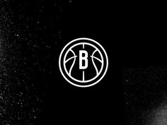 a basketball ball with the letter b on it is in front of a black background