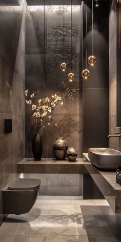 a modern bathroom with two sinks and a large vase filled with flowers on the counter